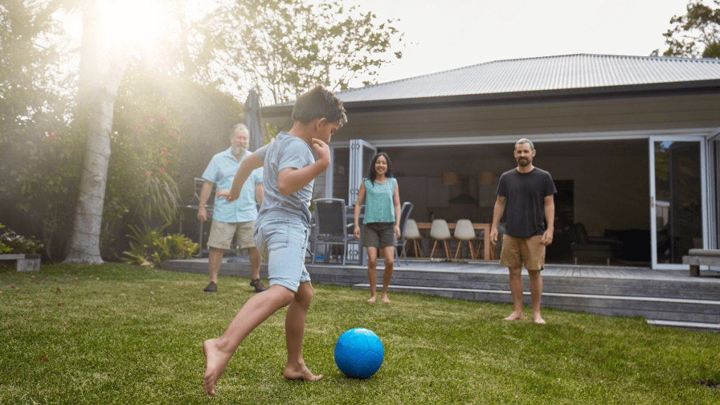 Australian family playing in the back yard garden