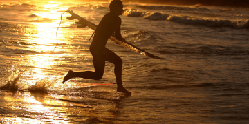 Man Surfing at Bondi Beach