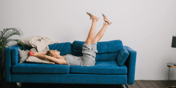 Smiling Woman Laying on the Couch