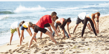 Workout on the beach with instructor