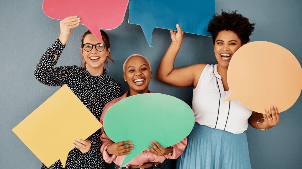 women holding speech bubbles